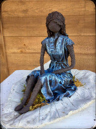 Girl Sitting on Cement Leaf